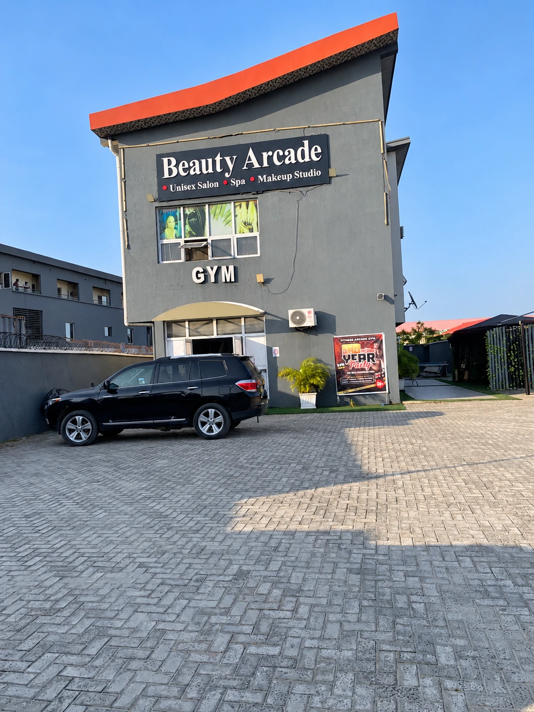 Beauty Arcade Building entrance with Gym signage at Abijo GRA 2nd Gate